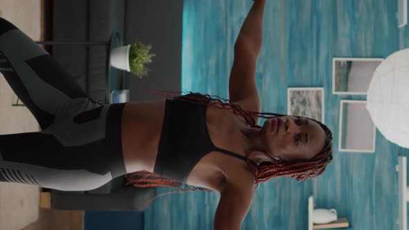 Verical Video Athletic Woman with Black Skin Warming Up Before Aerobic Class alt