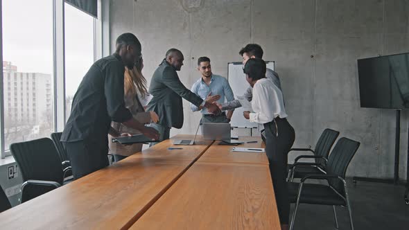 Multiracial Group of Colleagues Multiethnic Corporate Workers Shaking Hands Making Handshake alt