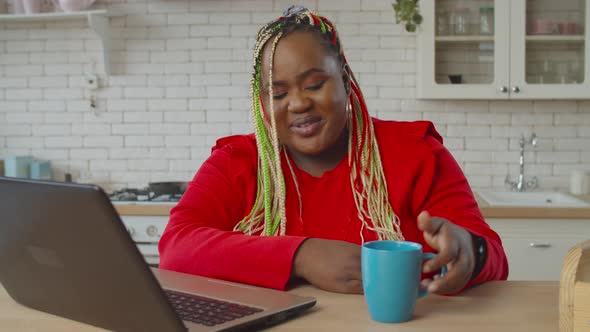 Female Enjoying Entertainment Content on Laptop alt