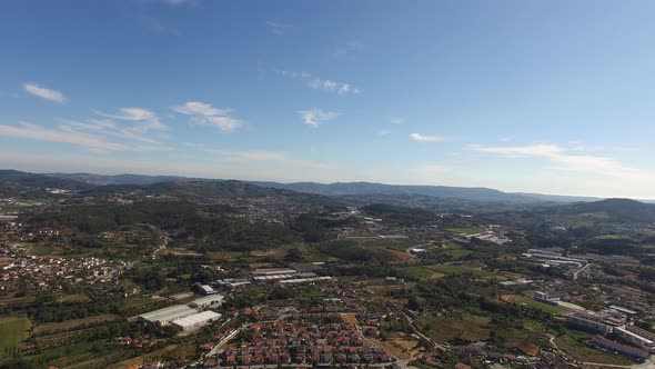 High Drone Footage of Countryside. Houses, Fields, Roads, Industrial Buildings alt