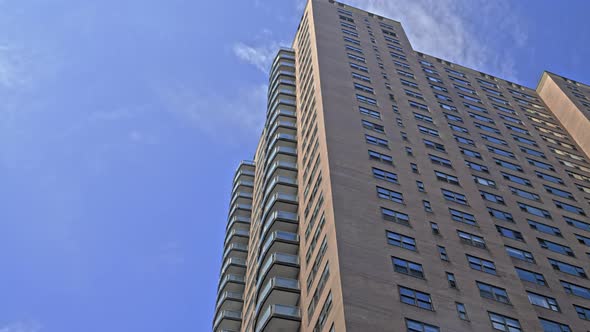 New York City Blocks Of Apartments Under Blue Sky alt