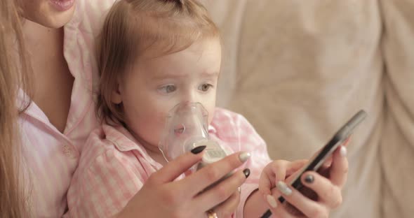 Mother Curing Little Daughter and Caring About Health