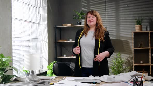 Caucasian Tailor Working at Her Office Looking at Camera and Positively Smiling Small Business alt