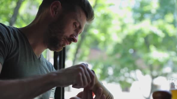 Man Eating Food At Restaurant, Seasoning Meat Steak With Pepper alt