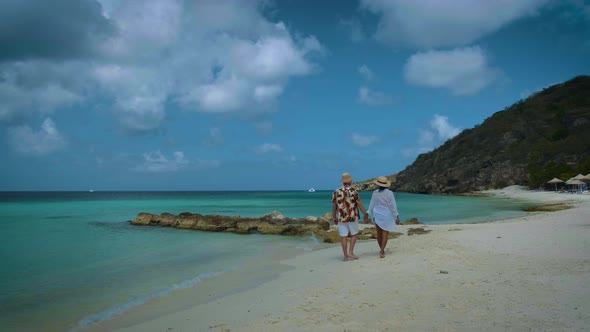 Couple Men and Woman Mid Age on the Beach of Curacao Grote Knip Beach Curacao Dutch Antilles alt