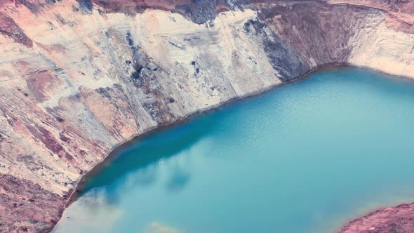 Azure Surface of the Lake in the Technological Clay Quarry  Aerial Shot alt