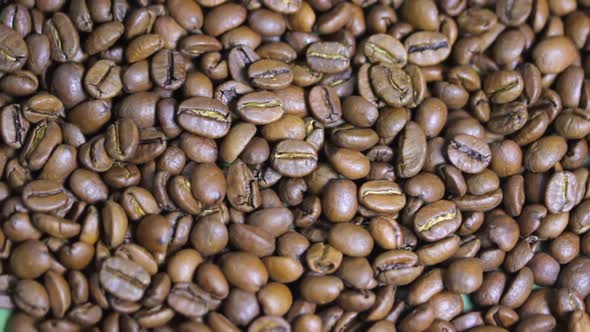 Macro Shot of Coffee Beans That Rotate on a Plate