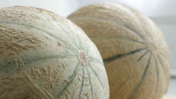 Slow tilt on  Cucurbitaceae family melopepo healthy fruit texture on kitchen table 4K 2160p 30fps Ul alt