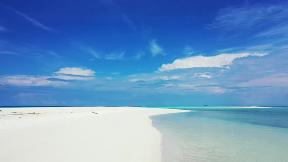 Wide birds eye travel shot of a summer white paradise sand beach and aqua turquoise water background alt