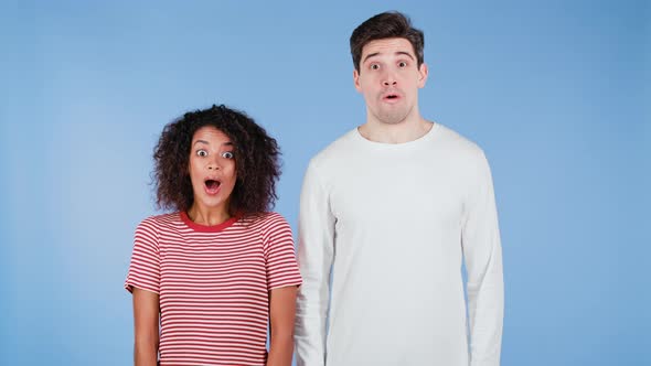 Amazed African American Woman and White Man Shocked Saying WOW alt