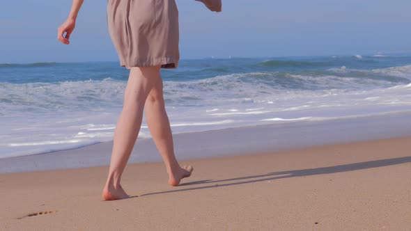 Woman Walking on Beach Ocean Waves alt