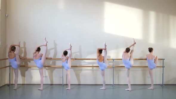 Girls Studying in Ballet Gymnastic Class Practicing Battement Ballet Position alt