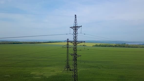 High-voltage Power Pylon on the Green Field alt