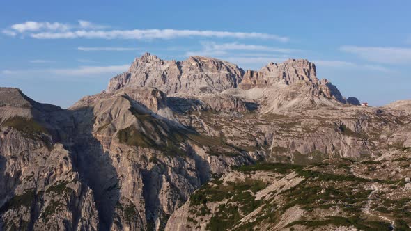 View From Above of Giau Pass in Dolomites Mountain in Italy Against Blue Sky alt