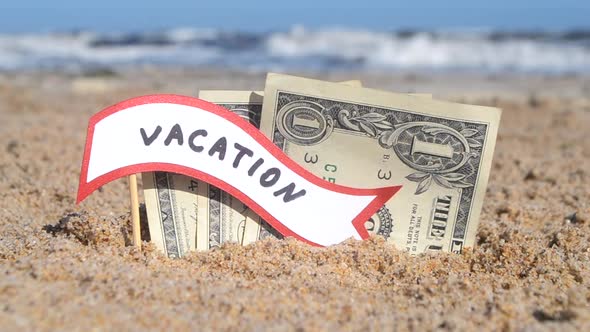 Paper Bills One Dollar and Small Stick Paper Speech Bubble with Word Vacation alt