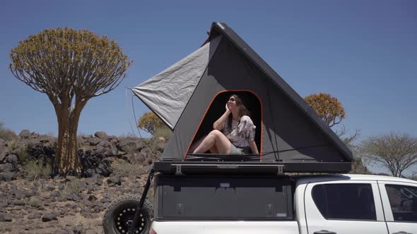 SUV Car with Camping Equipment Rooftop Tent Spare Tire