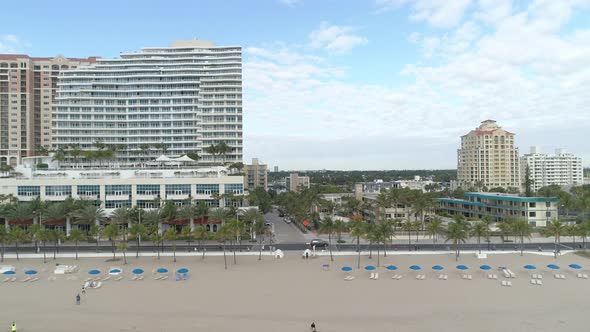 Aerial view of buildings along the beach alt