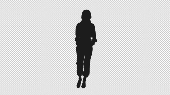 Silhouette Of Young Woman Walking Slowly With Hands In Pockets