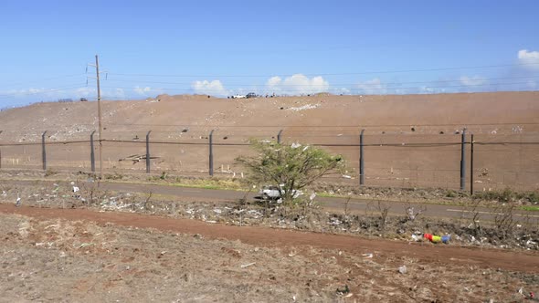 Light Trash Flew From the Garbage Facility Plant To Countryside Field Cross Road alt