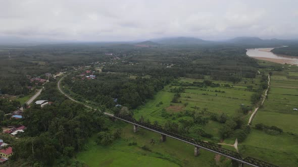 Aerial view of Forest, Village, railway, river and farm in Kelantan