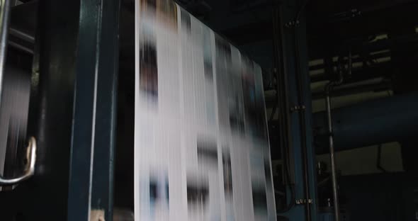 Print Plant Factory. Newspaper Printing at a Plant. Newspaper Printed on a Printing House Machine alt