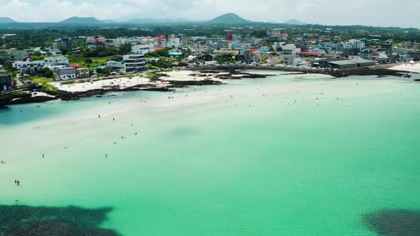 A panoramic view of the blue beach of Jeju Island. alt