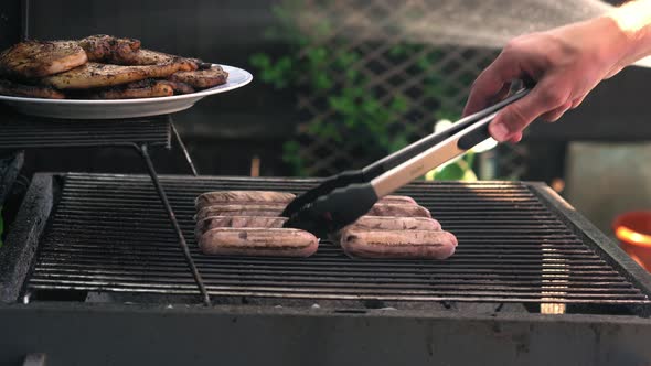 Spicy Sausages Being Grilled Over Bright Glowing Coals Broasting On Fire