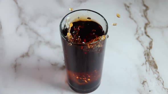 Ice Cube Falls Into the Cola