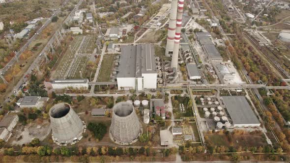 Aerial View of the High Pipes of the Thermal Power Plant Near the Modern City alt