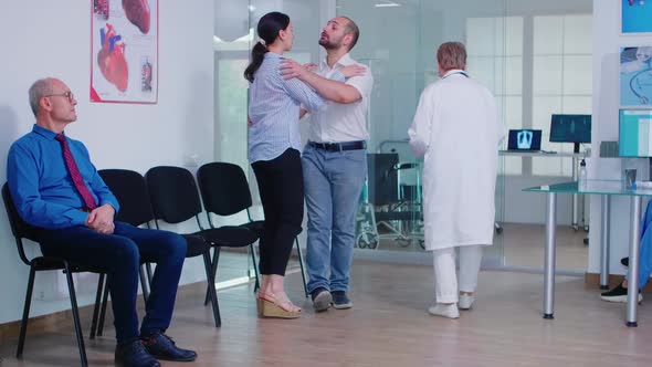 Bad News From Doctor in Hospital Waiting Area alt