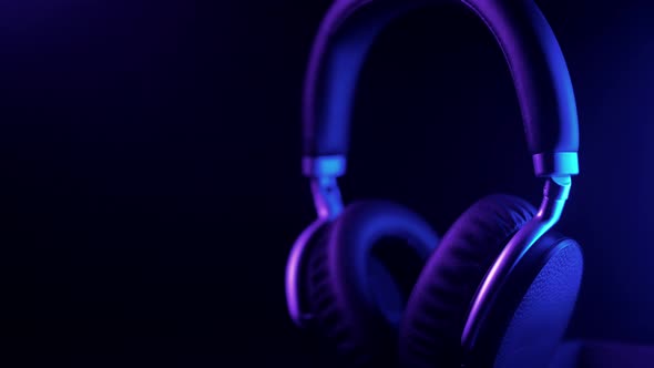 Studio headphones in a beautiful purple dynamic light.