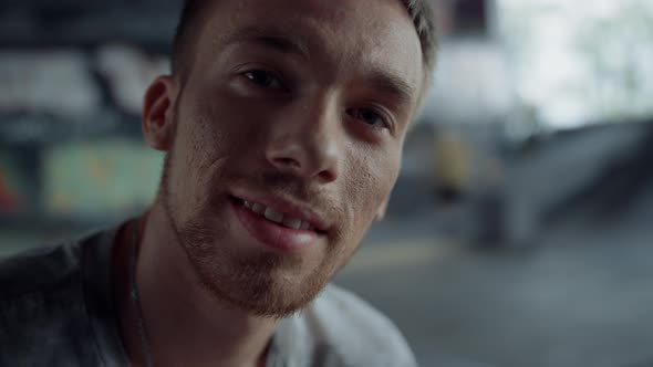 Handsome Man Looking Camera at Skatepark alt