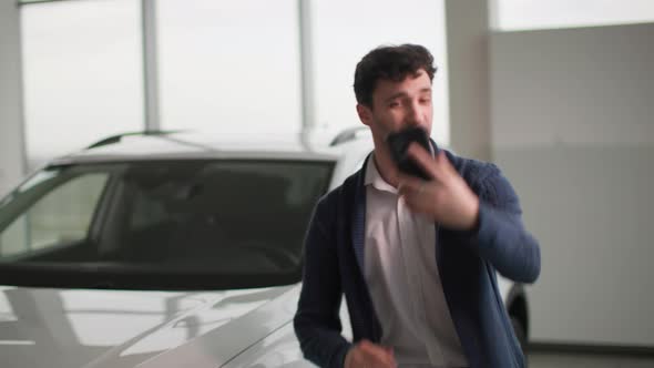 Purchase Car Happy Owner of a New Automobile Shoots Video on His Phone and Shares Joy Via Video Link