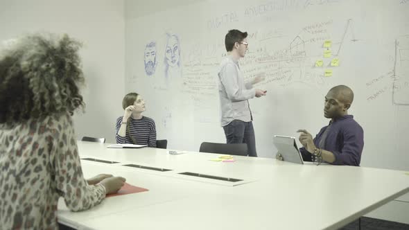 Men and women having meeting in conference room