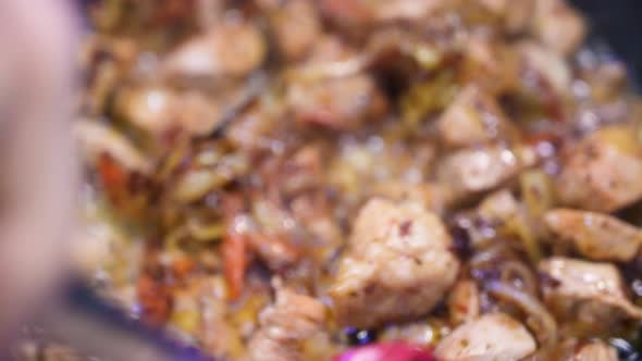 Pieces of Meat Are Fried in a Pan. alt