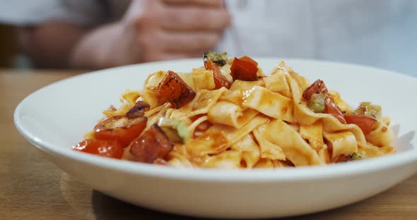 Chef Puts Vegetables in Pasta Cooking in Italian Restaurant