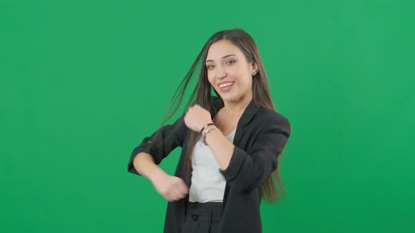 Happy Successful Businesswoman Is Dancing on Chromakey Green Screen Background alt