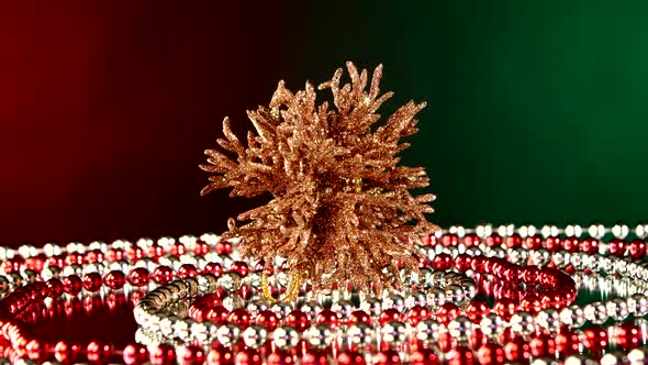 Unusual Coral Toy for Christmas or New Year and Beads, Rotation, on Red and Green, Reflection alt