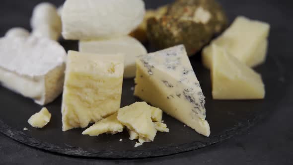 Various Types of Cheese on a Rotating Plate