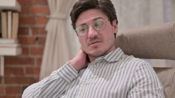 Portrait of Middle Aged Man having Neck Pain alt