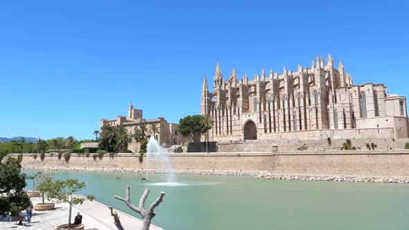 Static shot of facade of Cathedral of St. Mary of Palma on sunny day, Spain alt