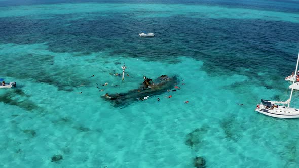 Aerial View of Snorkeling in the Caribbean Sea Near the Sinked Ship alt