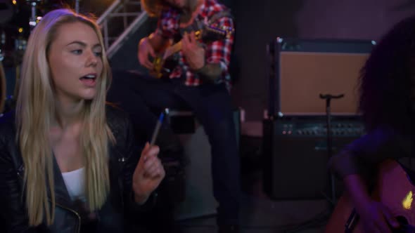 Musicians rehearsing together before performing alt