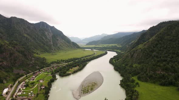 European Houses Near a Mountain River alt
