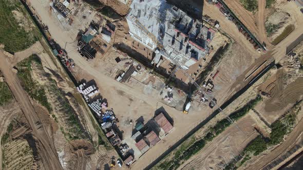 Construction site for a new city block. Construction work is underway. alt