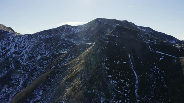 Aerial, Alps Mountains Partially Covered With Snow In Italy