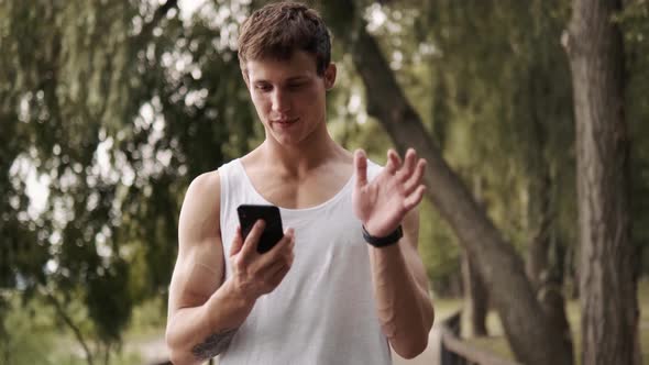 A handsome guy is turning off his mobile alt