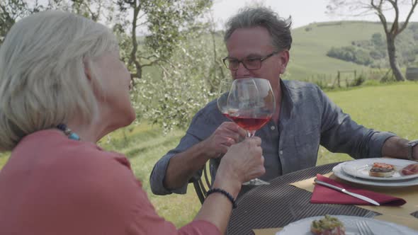 Senior couple eating alfresco