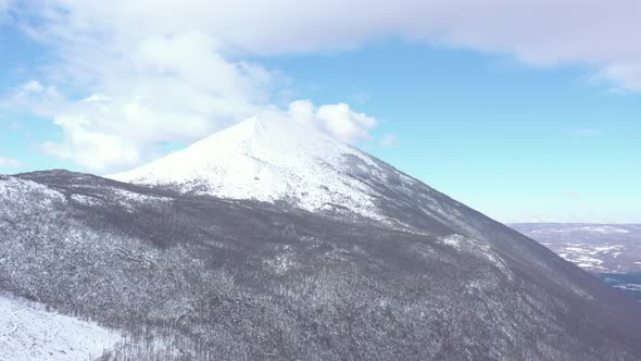 Clouds over the top of the Rtanj mountain 4K aerial video alt
