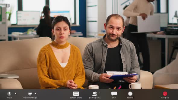 Colleagues Talking with Partners Using Webcam During Video Conference alt